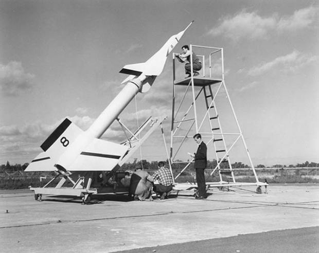 Avro technicians prepare an Avro Arrow test model attached to a Nike booster rocket to fire out over Lake Ontario at Point Petre in the 1950s.