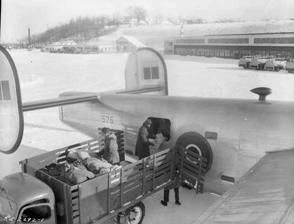 Mail trucks load the B24 with mailbags on a winter's day at Rockcliffe Airport 1944.