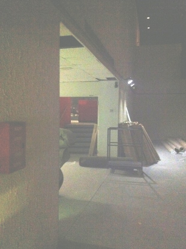 Abandoned theatre lobby area, stairs into the theatre shown. Main entrance doors would have been to the left, around the corner. Escalators to second level cinema to the right (offscreen).
