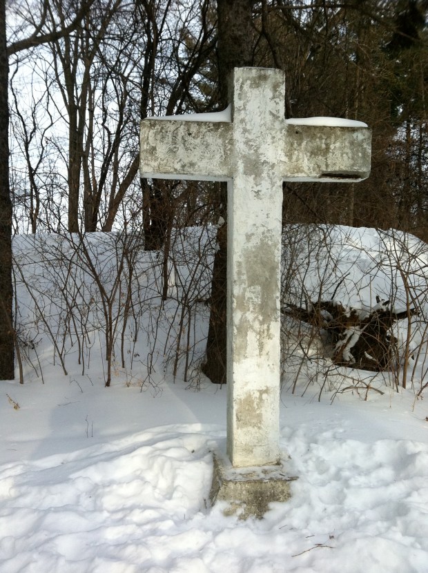 A cement cross sits on the southeast corner of the mystery mound.