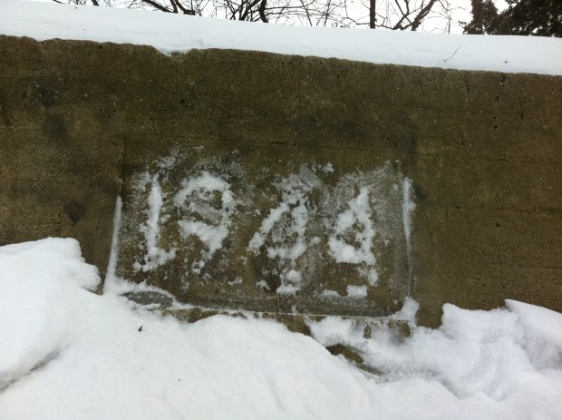 A date became visible when snow was rubbed across an inscription above the sealed entrance.