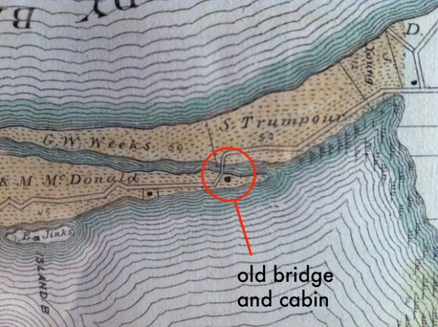 close-up detail of the old map that shows both the old bridge and the log cabin location.