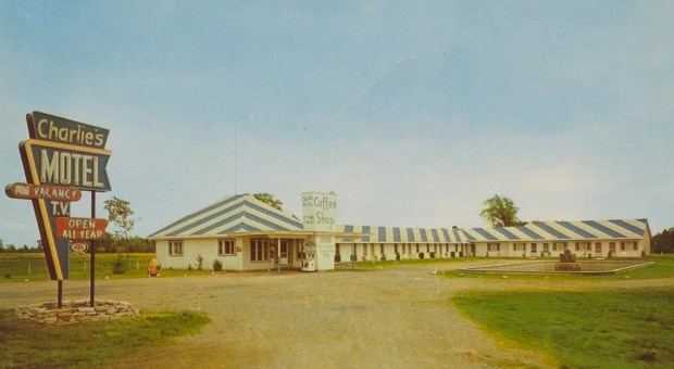 A 1950s postcard showing "Charlie's Motel". Note the distinctive striped roof.