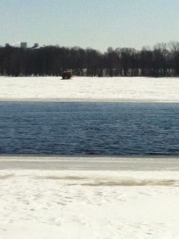 The beacon ruins, literally frozen in time, encased in ice on the Ottawa River. The neighbourhood of Beacon Hill, which got its name from this very lighthouse,  is in the background. 