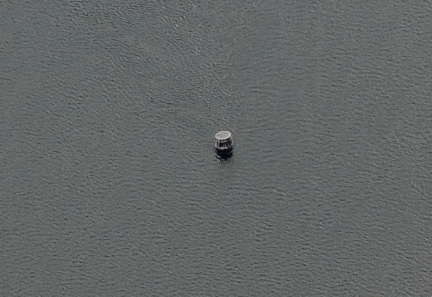 All that remains of the lighthouse are the iron-clad rusty remnants of the beacon's pedestal.