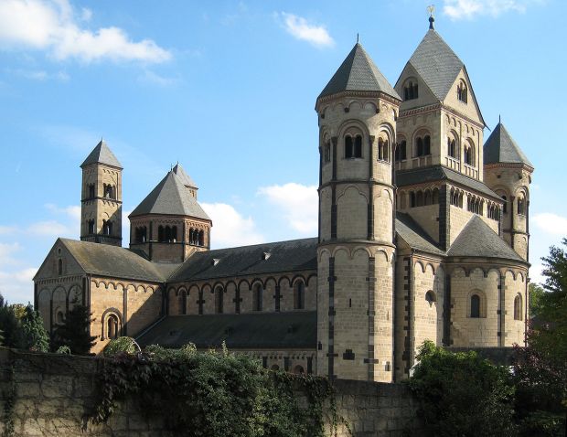 The Romanesque style featured on the church by the architect Edey  featured turrets and arches, like medieval European castles.