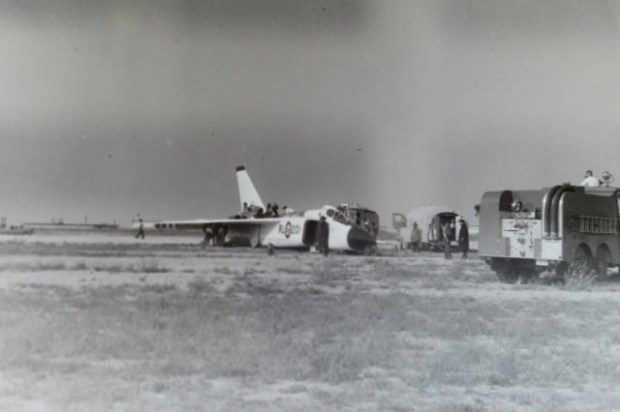 NEGATIVE 2 INVERSION: RL201 skidded off the runway after the landing gear collapsed.