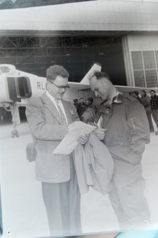 NEGATIVE 5 INVERSION: Arrow test pilot Zurakowski chatting with someone. 