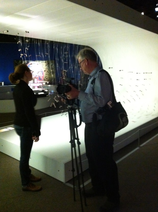 Iron rivets that once held together the wooden planks of a Viking ship are suspended by fishing line to reveal a "Ghost Ship" hull shape.