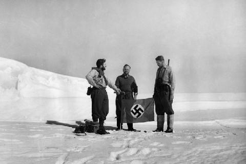 The Nazi flag being placed on Antarctica. 1939. (photo: WikiLeaks)